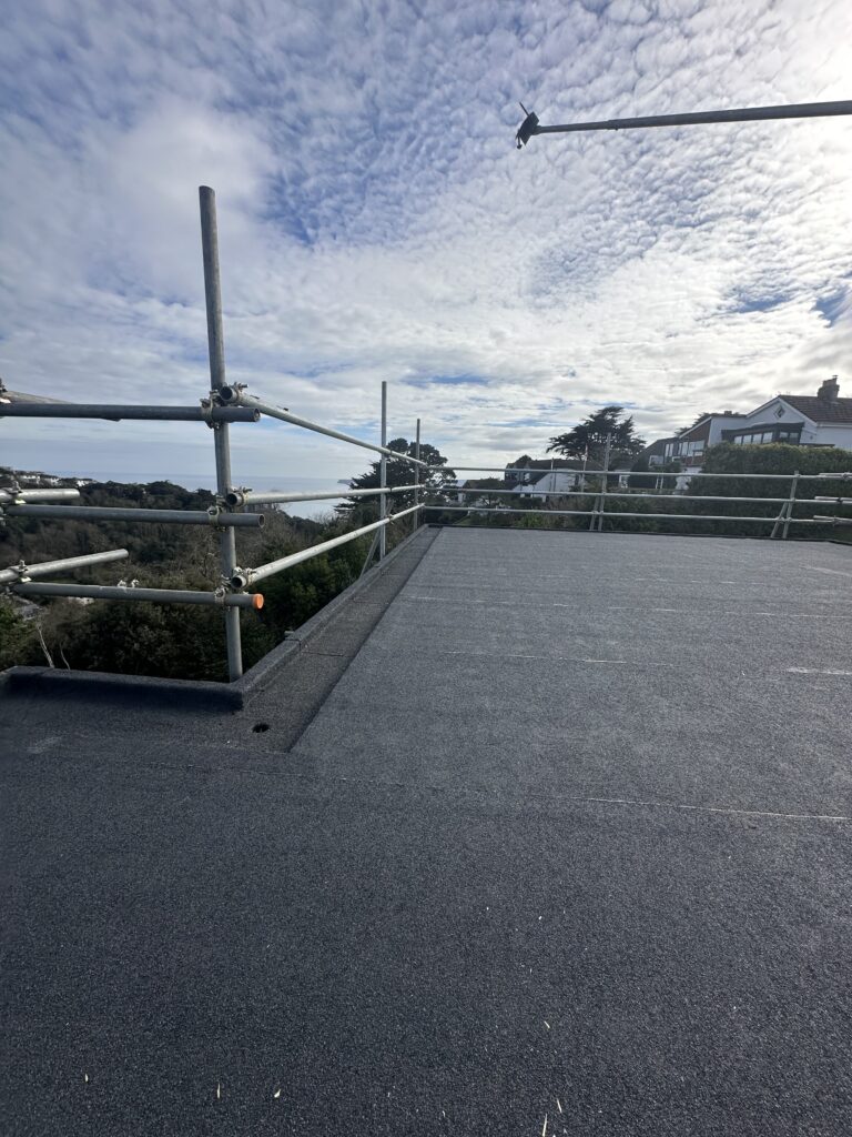 Scaffolded rooftop with scenic view.